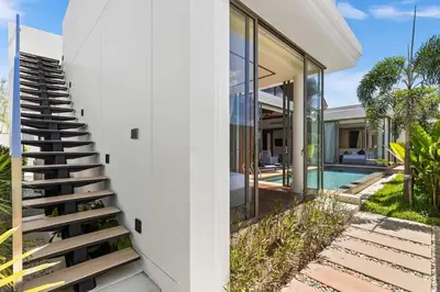 a staircase leading up to a house with a pool at The Ozon Bangtao 3-bedrooms Villas with pool by My Home Phuket in Laguna Phuket
