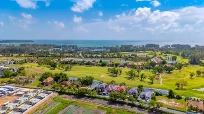 an aerial view of a residential neighborhood with houses at Villa Viola 7 Bedroom, Fully Staffed, on the Golf Course in Laguna Phuket