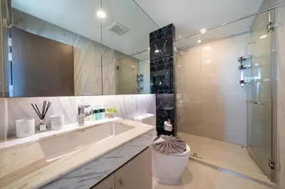 a bathroom with a tub and a shower and a sink at Surin sea view 3br apartment with jacuzzi in Surin Beach