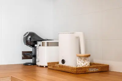 a food processor sitting on top of a counter at Title Halo Vitamin Sea 40m2 King Bed Naiyang in Nai Yang Beach