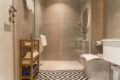 a bathroom with a shower and a toilet at Title Halo Vitamin Sea 40m2 King Bed Naiyang in Nai Yang Beach