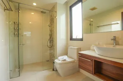 a bathroom with a toilet and a sink and a shower at C251 Beachfront gym Sauna 7 Swimming Pool in Rawai Beach