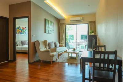 a living room with a couch and a table at C251 Beachfront gym Sauna 7 Swimming Pool in Rawai Beach