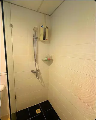 a shower with a glass door in a bathroom at Patong Tower Near Beach in Patong Beach