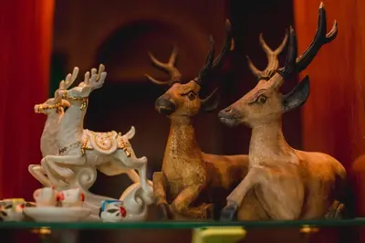 a group of three deer statues sitting on a table at RK Guesthouse in Patong Beach