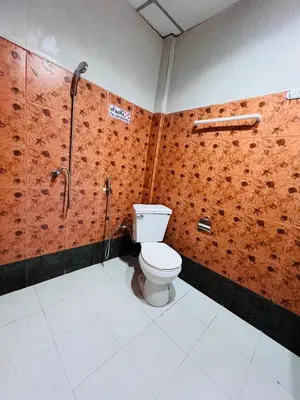a bathroom with a toilet and a shower at Patong Adventure Hostel in Patong Beach