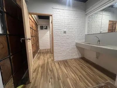 a bathroom with a sink and a mirror at Patong Adventure Hostel in Patong Beach
