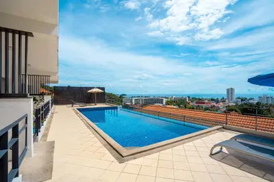 a swimming pool on the roof of a building at Hillside Seaview Residence in Karon Beach