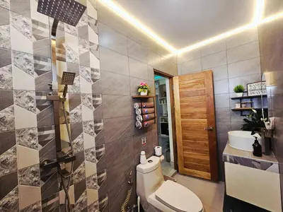 a bathroom with a toilet and a sink at Tropical Oasis Aoyon Beach House in Ban Ao Makham