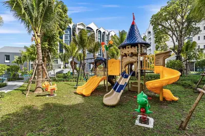 a park with a playground with slides and a tower at The Title Halo NaiYang by My Home Phuket in Nai Yang Beach