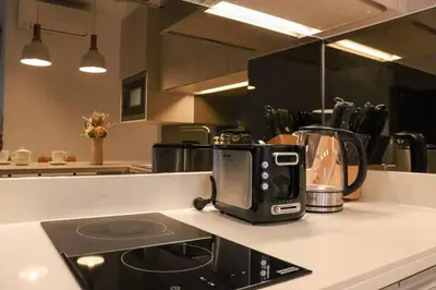a kitchen counter with a coffee maker on a counter top at Cassia Residences Sea View in Laguna Phuket