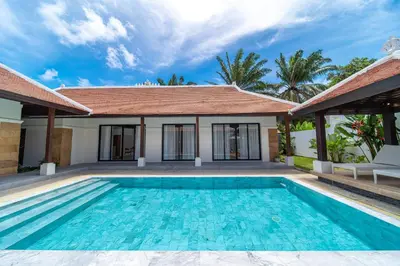 a swimming pool in front of a villa at Luxury 4 Bedrooms 800 square meters of large space Private swimming pool private kitchen service Family and friends vacation in Bang Tao Beach