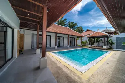 an image of a swimming pool in a villa at Luxury 4 Bedrooms 800 square meters of large space Private swimming pool private kitchen service Family and friends vacation in Bang Tao Beach