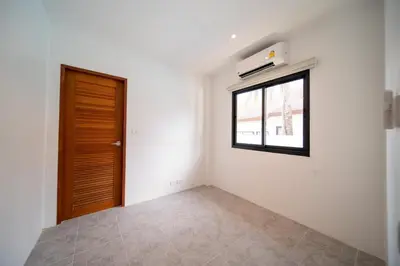 an empty room with a window and a door at Luxury 4 Bedrooms 800 square meters of large space Private swimming pool private kitchen service Family and friends vacation in Bang Tao Beach
