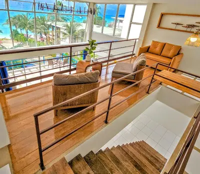 a living room with a view of the ocean at Beach Front Queen's Castle - Kid friendly, Holiday like Royalty in Ban Ao Makham