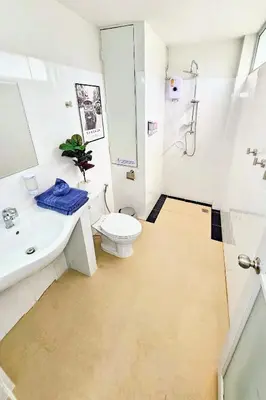a bathroom with a toilet and a sink and a shower at Beach Front Queen's Castle - Kid friendly, Holiday like Royalty in Ban Ao Makham
