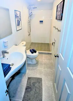 a bathroom with a sink and a toilet and a shower at Beach Front Queen's Castle - Kid friendly, Holiday like Royalty in Ban Ao Makham
