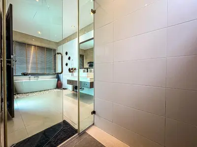 a bathroom with a glass shower and a tub at VILLA DESTINY - Luxury Villa Near Nai Harn Beach in Ban Saiyuan (1)