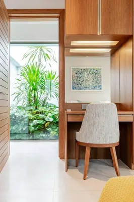 a dining room with a table and a chair at Stylish Pool Villa Tropical Hideaway in Ban Phru Champa