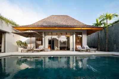 a villa with a swimming pool and a house at Stylish Pool Villa Tropical Hideaway in Ban Phru Champa