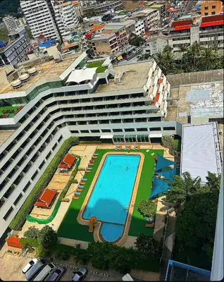 an overhead view of a large building with a swimming pool at Patong Tower Mountain View in Patong Beach