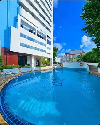 a large swimming pool in front of a building at Patong Tower Mountain View in Patong Beach