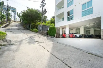 an empty street in front of a building at Mountain View Apt, High Speed Internet - 1BR-Karon in Kata Beach