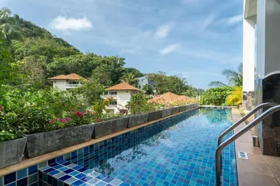 a view of a swimming pool at a resort at Mountain View Apt, High Speed Internet - 1BR-Karon in Kata Beach