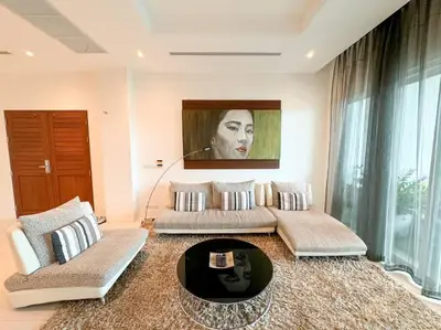 a living room with two couches and a table at Kamala Falls A3-4 IBG Property in Kamala Beach