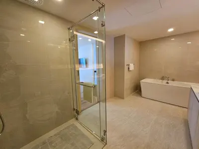 a bathroom with a glass shower and a tub at Duplex Luxury Apartments in 5 Star Hotel in Rawai Beach