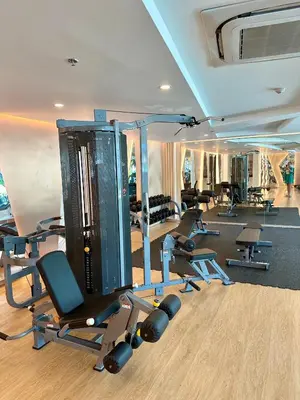 a gym with a bunch of treadmills and weights at Duplex Luxury Apartments in 5 Star Hotel in Rawai Beach
