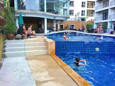a group of people in a swimming pool at Ocean View Treasure Residence in Patong Beach