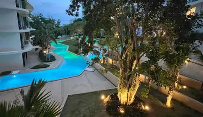 an overhead view of a swimming pool at night at Apartment 5 Star Hotel LaVita in Rawai Beach