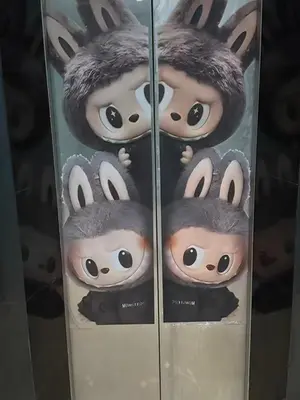a group of dolls in a glass case at \u592a\u9633\u82b1\u9152\u5e97\u4eb2\u5b50\u5957\u623f in Patong Beach