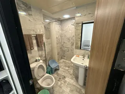 a bathroom with a toilet and a sink at 1 - Bedroom Apartment Pool Access, 750m to the Beach in Mai Khao Beach
