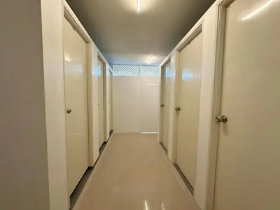 a hallway with white walls and a ceiling at Blue Horizon Hostel By Blue Flow in Phi Phi Don