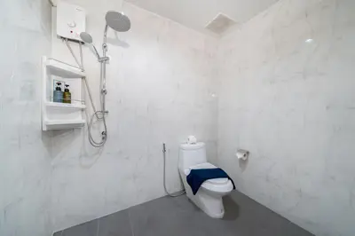 a white bathroom with a shower and a toilet at Patong private home 4BR Jazzuci sleep 10 in Patong Beach