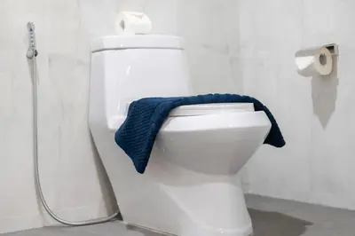 a blue towel sitting on a toilet in a bathroom at Patong private home 4BR Jazzuci sleep 10 in Patong Beach