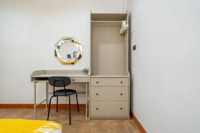 a bedroom with a desk and a refrigerator at Patong private home 4BR Jazzuci sleep 10 in Patong Beach