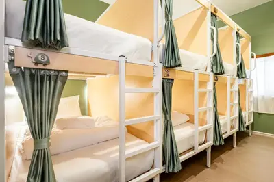 a couple of bunk beds in a room at Sweett Lemon Hostel in Patong Beach