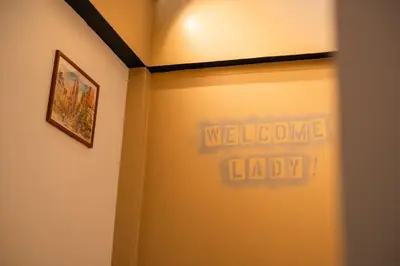 a hallway with a welcome label on the wall at Sweett Lemon Hostel in Patong Beach