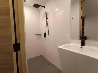 a white bathroom with a shower and a sink at Utopia Naiharn - Room3 - B124 in Rawai Beach