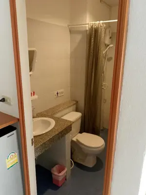 a bathroom with a toilet and a sink and a shower at Kata Goran in Kata Beach