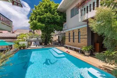 a large swimming pool in front of a building at Centre Point Nanai in Patong Beach