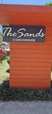 a sign for the santa claus condominium at Two bedroom apartment near Naiharn beach in Nai Harn Beach
