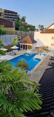 a view of a swimming pool at a resort at Two bedroom apartment near Naiharn beach in Nai Harn Beach