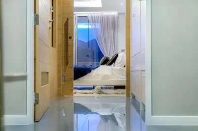 a mirror reflection of a bed in a room at Modern Pool Villa in Chalong in Chalong