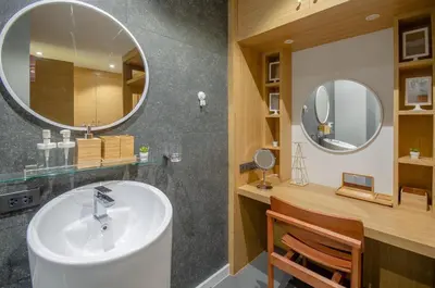 a bathroom with a sink and a mirror at Modern Pool Villa in Chalong in Chalong