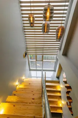 a staircase in a house with a skylight at Modern Pool Villa in Chalong in Chalong