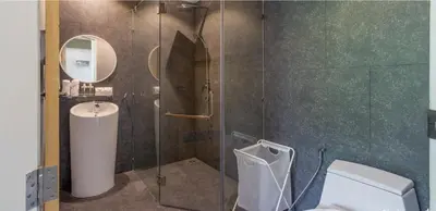 a bathroom with a shower with a toilet and a sink at Modern Pool Villa in Chalong in Chalong